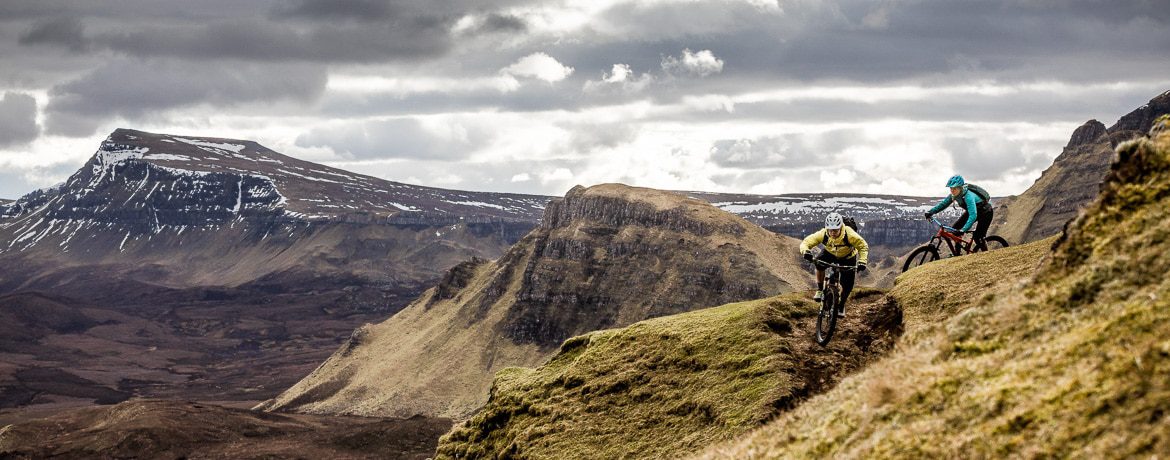 Mountain bikers riding the Quiraing on the Isle of Skye.